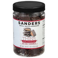 Jar of Sanders Dark Chocolate Sea Salt Caramels with a black lid on a white background